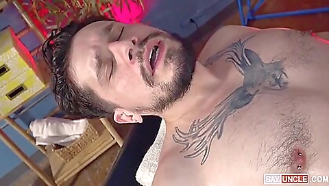 Brunette gets her ass massaged by the black masseuse