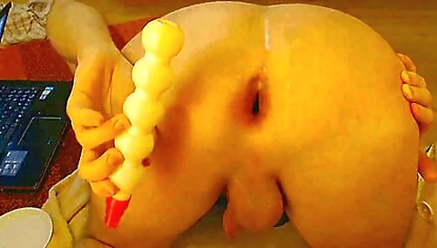 Gaping brunette is masturbating while getting stuffed