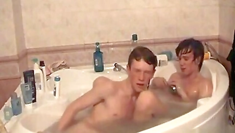 two horny guys in the bathroom having a great time